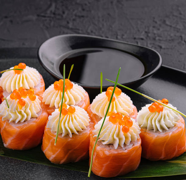istock sushi rolls wrapped with salmon and caviar 2002176738