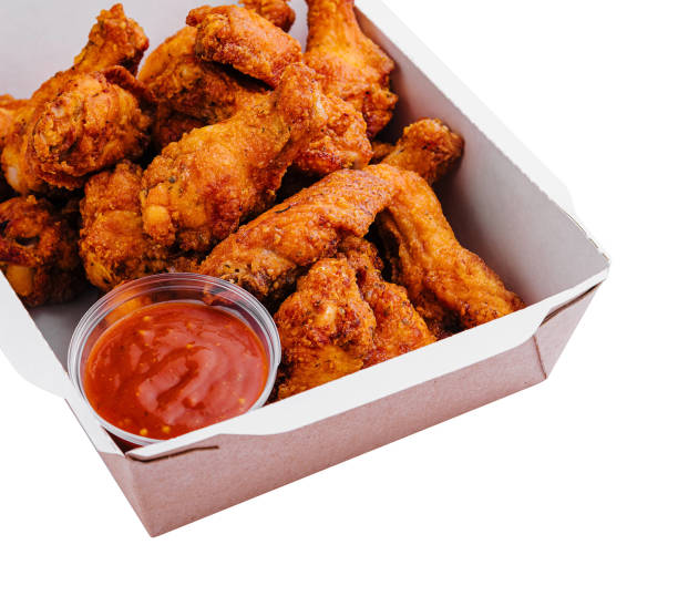 istock Takeaway box of crispy grilled chicken legs 2002177277