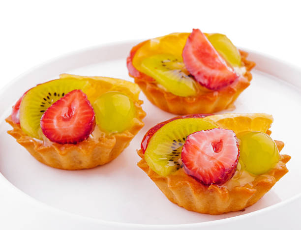 istock Mini tarts with cream and mix of summer fruit 2002178357