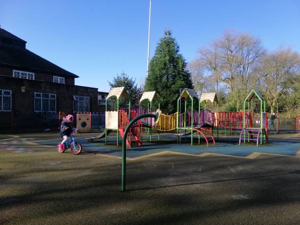 istock A little girl playing bicycle at the playground 2002178363
