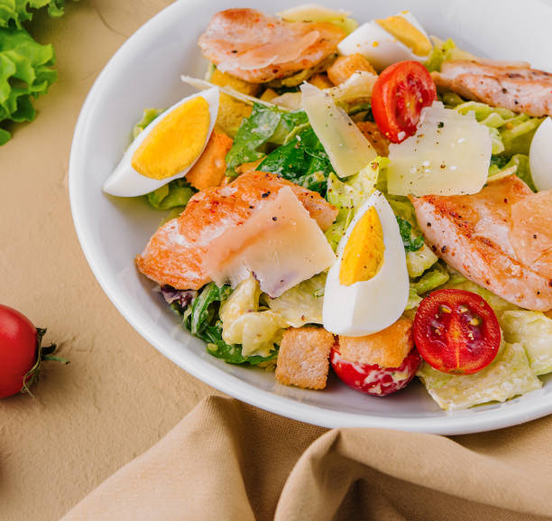 istock Chicken and shrimp caesar salad top view 2002187961