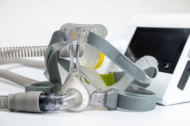 istock Continuous positive airway pressure system includes of CPAP machine, mask, tube on white background. 2002198909