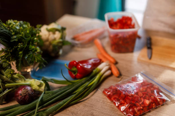 Close up shot of chopper red pepper packed in a freezer bag for winter preservation.