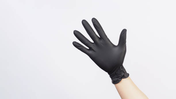 istock Hand is wear black latex glove on white background. 2002224836
