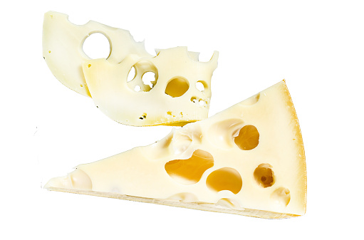 Piece of Maasdam cheese with large holes.  Isolated on white background. Top view