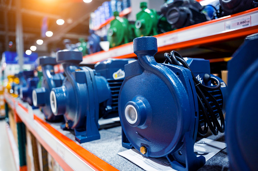 Industrial water pump with electric motor for community on a store shelf.