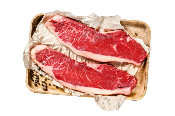 istock Fresh raw marbled beef steak.  Isolated on white background. Top view. 2002270306