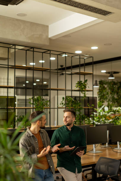 istock Collaborative Discussion in a Modern Office With Exposed Brick Walls 2002270918