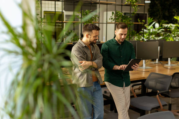 istock Collaborative Discussion in a Modern Office With Exposed Brick Walls 2002270922