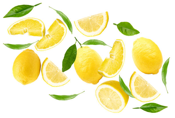 istock flying lemons with slices and green leaves isolated on white background. clipping path 2002278832