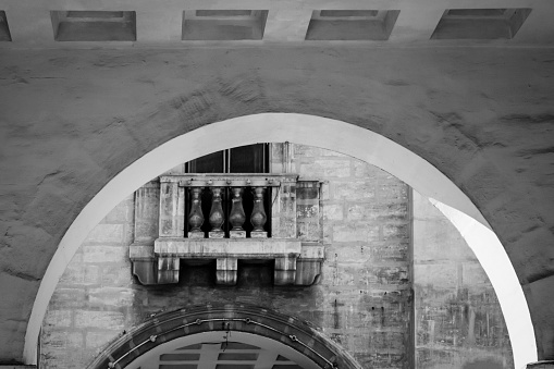 a detail of a more than 80 years old building in black and white taken in Floriana, Malta