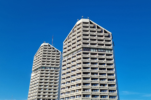 Wroclaw, Poland, May 1, 2022: Two high-rise buildings against the blue sky