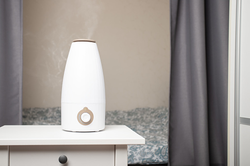 humidifying the room with an ultrasonic air diffuser