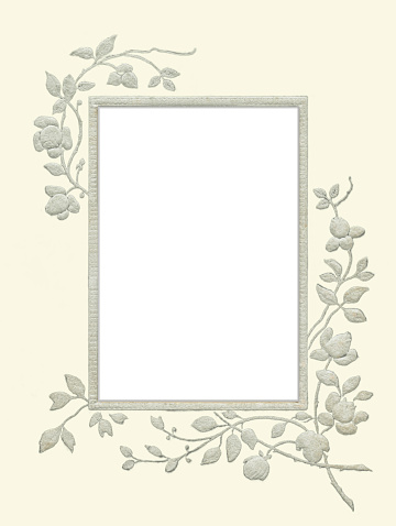 Picture frame with floral decor in the style of the early 20th century.
