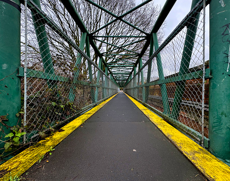 Metal foot bridge over a railway line