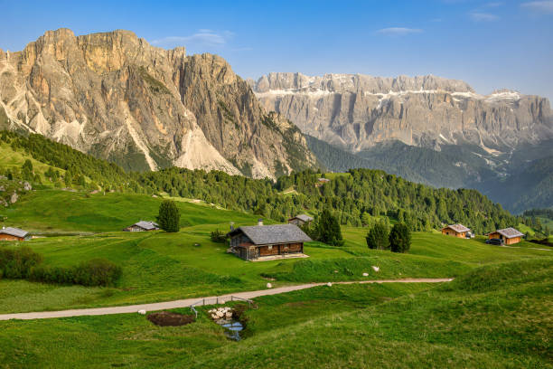 istock Wooden huts and rocky ranges in the Dolomites 2002450011