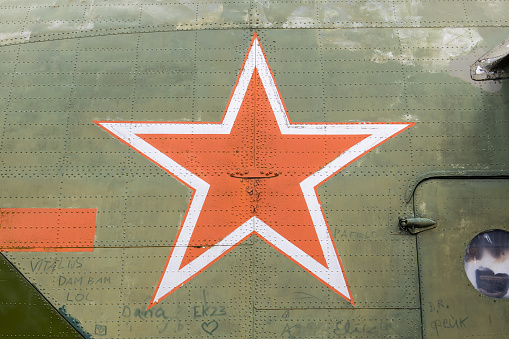 Identification mark of the Air Force of the Russian Federation, a five-pointed red star, bordered by a white stripe on an old military transport helicopter of the Russian Air Force