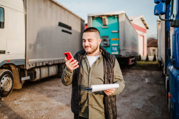 istock Professional truck driver in front on his truck 2002473388