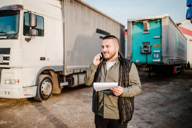istock Professional truck driver in front on his truck 2002473403