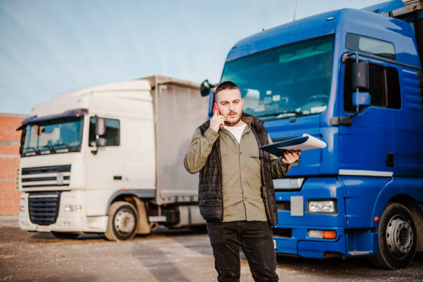 istock Professional truck driver in front on his truck 2002474449