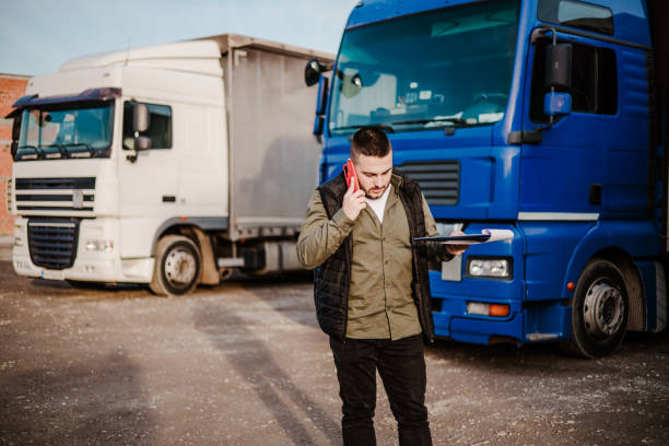 istock Professional truck driver in front on his truck 2002474489