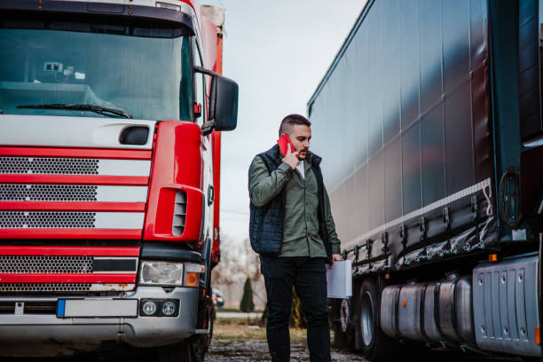 istock Professional truck driver in front on his truck 2002475047