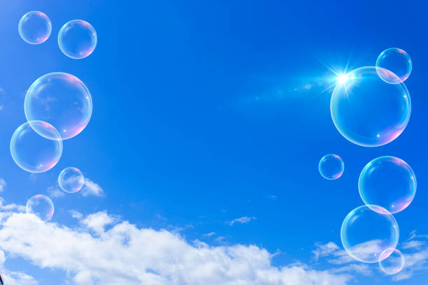 istock Background material of refreshing blue sky, clouds and sparkling soap bubbles 2002484600
