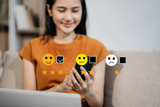 istock User give rating to service experience on online application smartphone. 2002486773