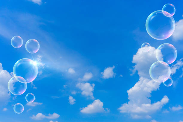 istock Background material of refreshing blue sky, clouds and sparkling soap bubbles 2002492296