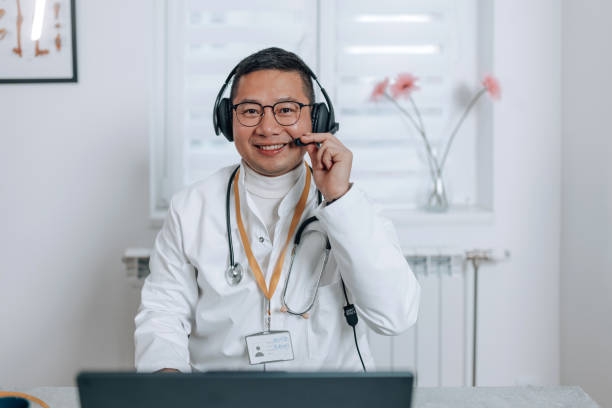 istock Chinese doctor check his microphone 2002504179