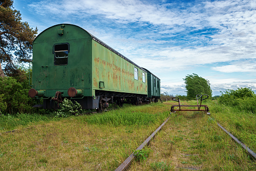 An old rusty train car in retirement