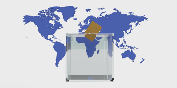 A transparent ballot box in front of a map of the world and a vote cast in it.\nAbove the map it says world at elections.\n2024 is a year in which elections almost all over the world coincide with the same year. This year, billions of people will go to the polls and vote for democracy.