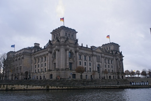 Berlin, Germany - Jan 14, 2024: The Reichstag building is the building of the German Parliament. On April 30, 1945 the soviet flag was hoisted over the building. Cloudy winter day. Selective focus