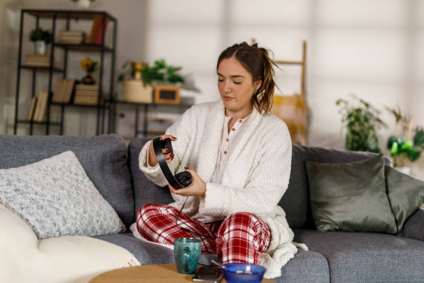istock Putting headphones to start her day with some music 2002535255