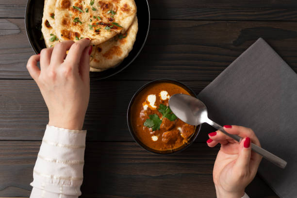Indian Butter Chicken Curry served together with garlic naan and basmati rice.