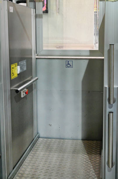 Accessible Elevator with sign. Disabled persons lift near modern apartment facility. The special elevator for the disabled at the entrance to the living house. Equipment with the wheelchair.