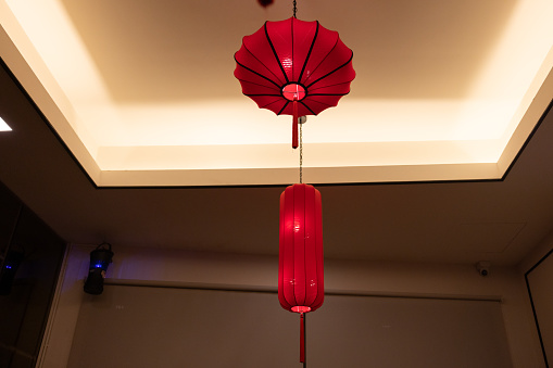 red chinese lantern is hanging on the ceiling.