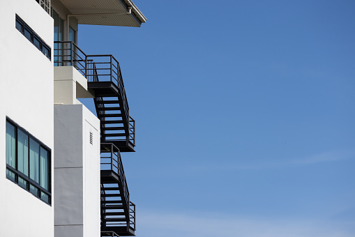 fire escape stair steel. black outdoor metal stair of building.