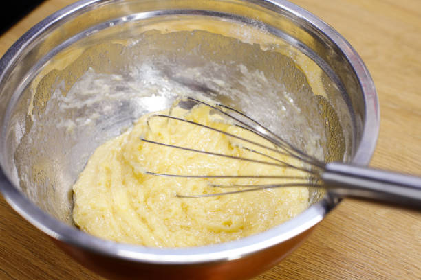 istock dough with a whisk in a deep bowl 2002587273
