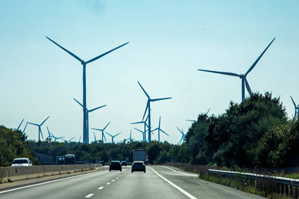 istock wind power station along the highway during the day. Saving electricity 2002605298