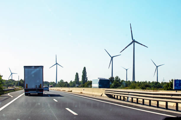istock wind farm along the highway during the day. Crisis Saving electricity 2002605809