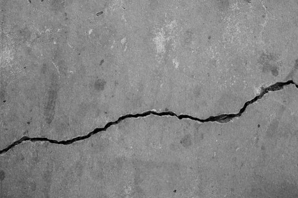 istock Cracked concrete wall broken wall at the outside cement corner that effected with earthquake and collapsed ground 2002613792