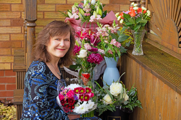 Adele's floral tribute for her acquisition. A great teacher lasts a generation. Nowadays, those that do, also often continue with part time work, after acquisition. teacher retirement party stock pictures, royalty-free photos & images