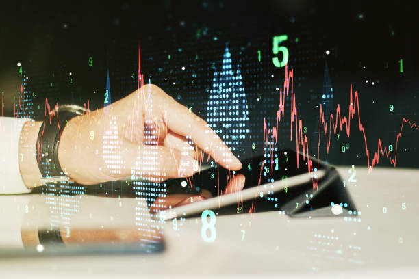 istock Multi exposure of abstract creative financial graph with finger presses on a digital tablet on background, forex and investment concept 2002639532