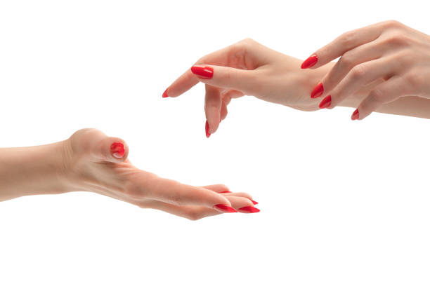 istock Woman hand with red nails holding something. 2002662053