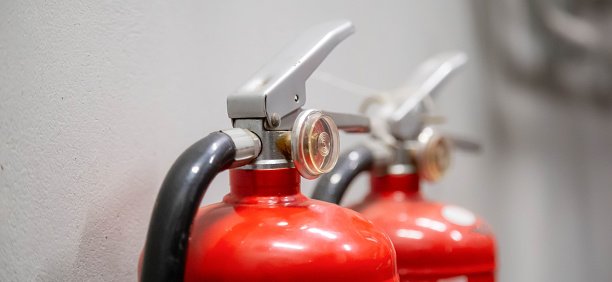 Fire extinguisher on the wall Fire extinguishing system inside the building.