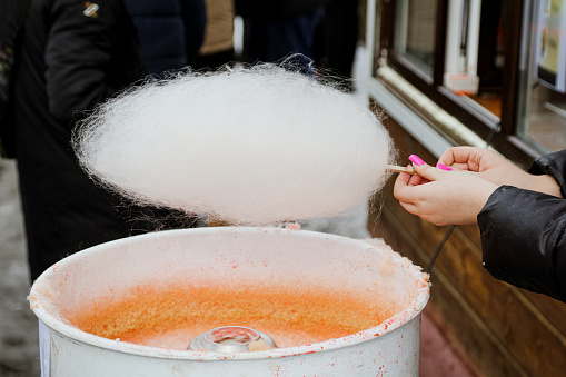 Cooking cotton candy in the park.