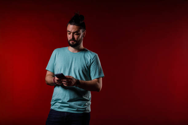 istock Man calling a friend from smart phone 2002704378