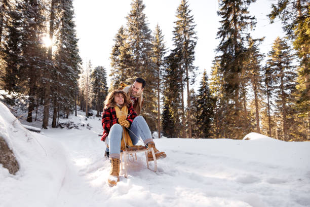 istock Young couple bonding while enjoying cold winter day together 2002795494