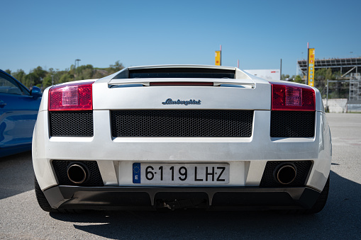 Montmelo, Spain – October 20, 2023: Rear view of pearl white Lamborghini Gallardo Italian supercar